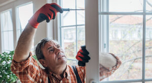 Homeowner fixing a door