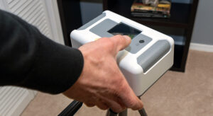 Homeowner holding a radon test device