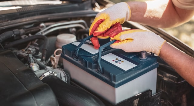 battery replacement service being performed by driver covered by car insurance