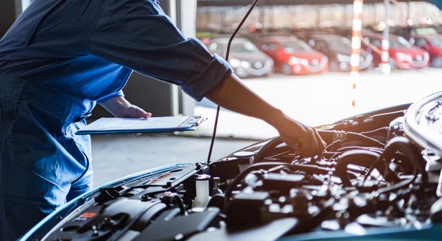 car repairs being performed by technician under insurance